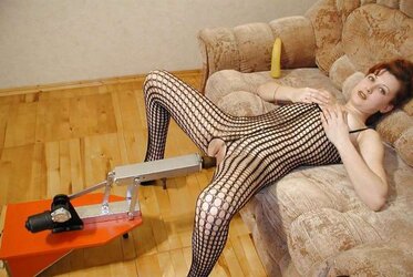 Redheaded queen pounded by romping machine