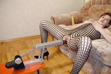 Redheaded queen pounded by romping machine