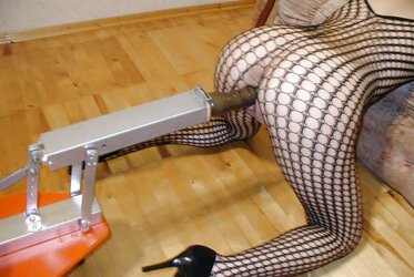 Redheaded queen pounded by romping machine