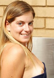 Smallish titted inexperienced gal posing in the kitchen
