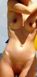 Secretly photographed nude on the beach