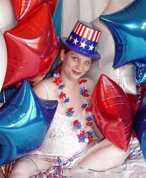 Pregnant redhead in white crimson and blue