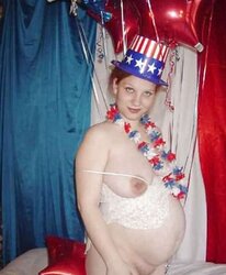 Pregnant redhead in white crimson and blue