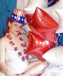 Pregnant redhead in white crimson and blue