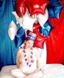 Pregnant redhead in white crimson and blue