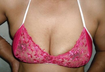 Indian mummy in net brassiere and wire thong