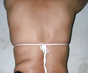 Indian mummy in net brassiere and wire thong
