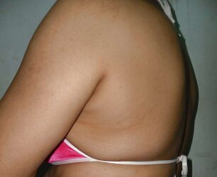 Indian mummy in net brassiere and wire thong