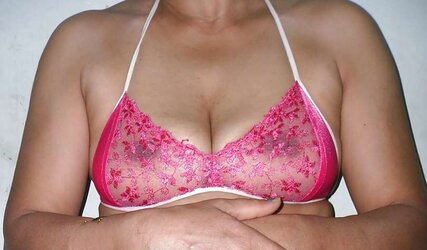 Indian mummy in net brassiere and wire thong