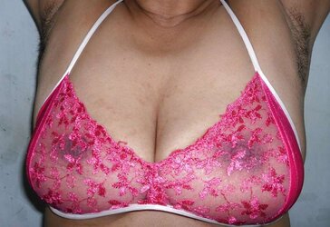 Indian mummy in net brassiere and wire thong