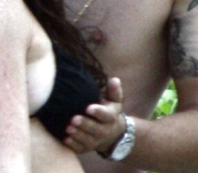 Lindsay Lohan having her tits grabbbed at the beach