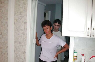 Russian mom Amalia with her son in the kitchen