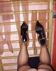 Her uber-cute gams and soles in nylons