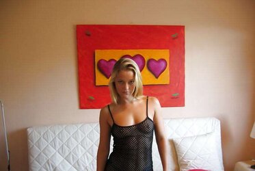 Luxurious blondie displaying and playing