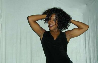 Fit dark Mimi posing