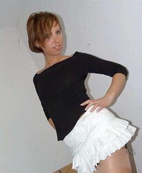 Kelly Dee wearing sunburn pantyhose on the bed