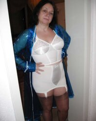Wifey in girdle and PVC Raincoat