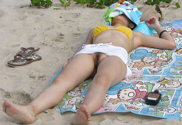 Korean nymph naked at the beach