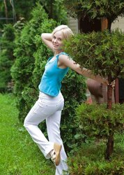 Tasty blond teenager Feeona posing at pool