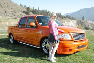 Chubby blondie posing in the mountains