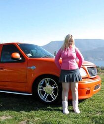 Chubby blondie posing in the mountains
