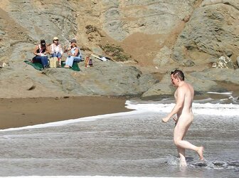 Caught erecting at bare beach