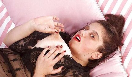 Buxomy black-haired PLUMPER playing with her fake penis