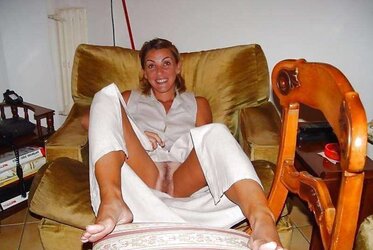 Individual revealed poised on couch