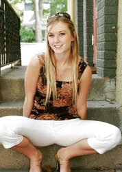 Blond teenager peels off outdoors on the steps