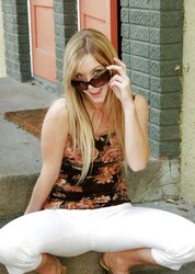 Blond teenager peels off outdoors on the steps