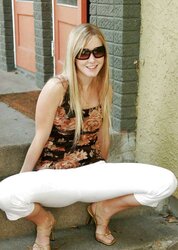 Blond teenager peels off outdoors on the steps