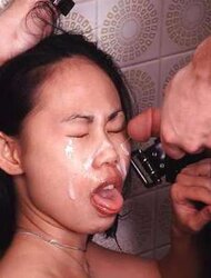 Asian dame Sandra getting a cum-shot in her face