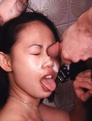 Asian dame Sandra getting a cum-shot in her face