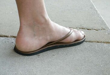 Soles and high-heeled shoes on the street