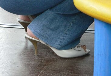 Soles and high-heeled shoes on the street