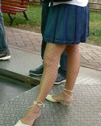 Soles and high-heeled shoes on the street
