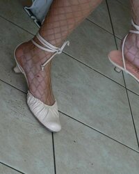 Soles and high-heeled shoes on the street