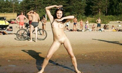 Naturist gilrs opening up gams on beach. Voyeur.