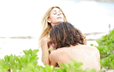 Shauna Sand having romp on the beach of St, Barth