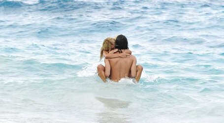 Shauna Sand having romp on the beach of St, Barth