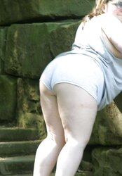 Kaylee outside in grey cut-offs