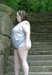 Kaylee outside in grey cut-offs