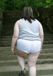 Kaylee outside in grey cut-offs