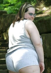 Kaylee outside in grey cut-offs