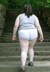 Kaylee outside in grey cut-offs