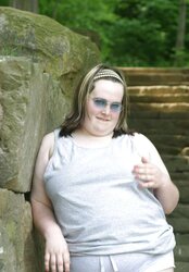 Kaylee outside in grey cut-offs