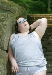 Kaylee outside in grey cut-offs