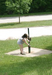 Kaylee outside in grey cut-offs