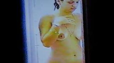 Voyeured thru window showering