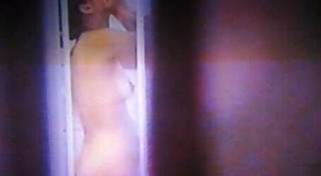 Voyeured thru window showering